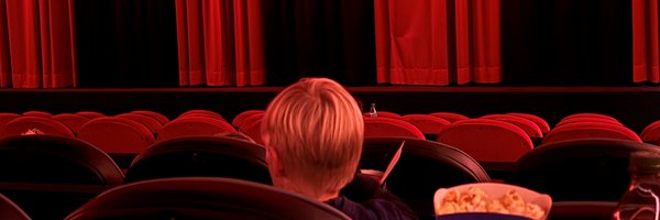 Kind im Kino bei der Abschlussparty des FerienLeseClubs